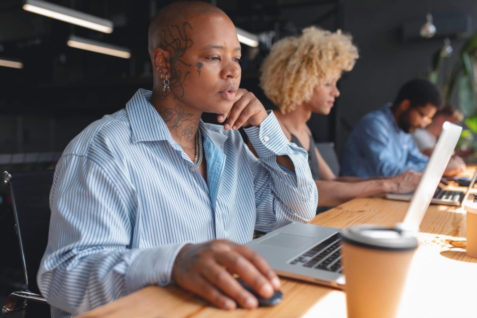 Person reviewing financial documents with calculator